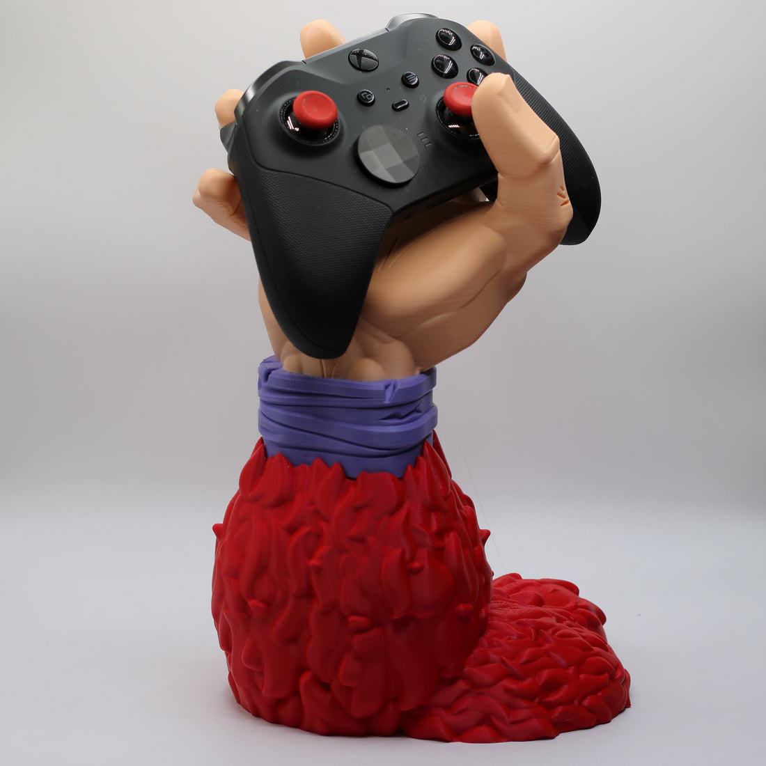Goku-inspired controller stand for an anime desk setup