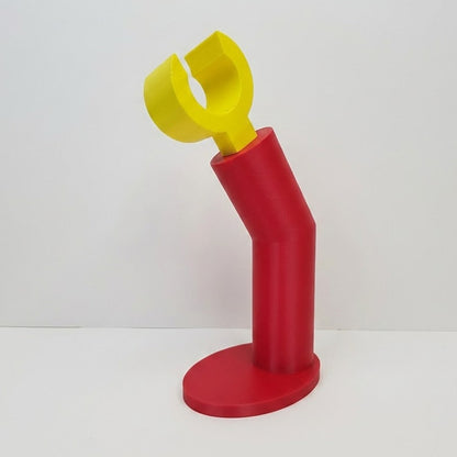 Red and yellow plastic tool on a white background