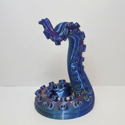 Blue ceramic dragon sculpture on a white background